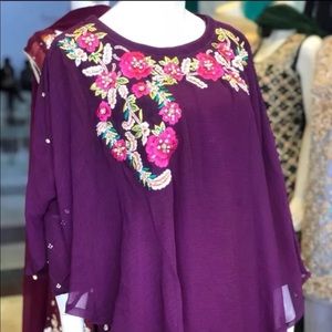 Designer inspired chiffon poncho style dress .